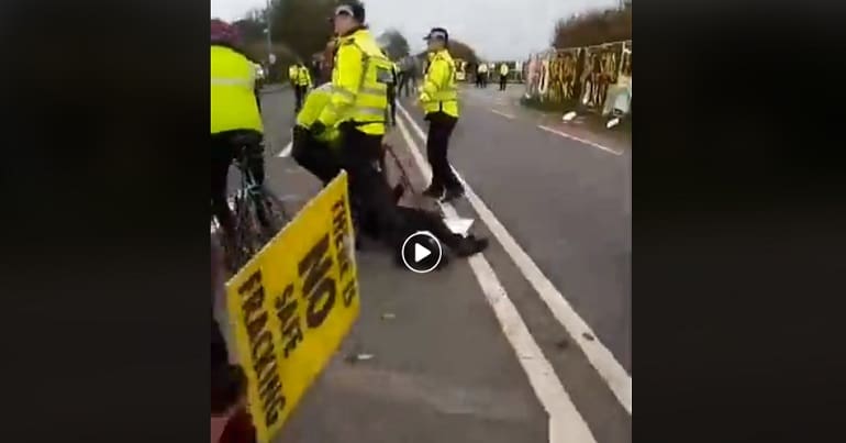 A disabled fracking protester and police
