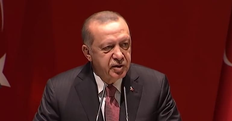 Erdogan on podium speaking to parliament 770 403