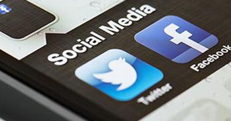 Smart phone screen with Facebook and Twitter apps