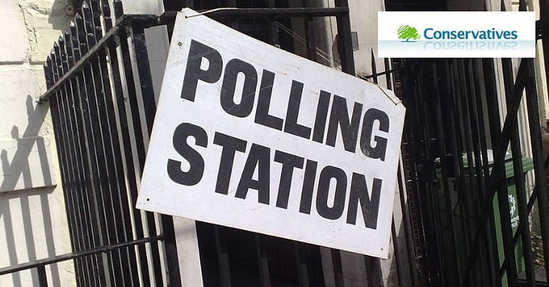 A polling station and the Conservative logo
