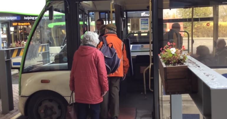 People board a bus in Lancashire