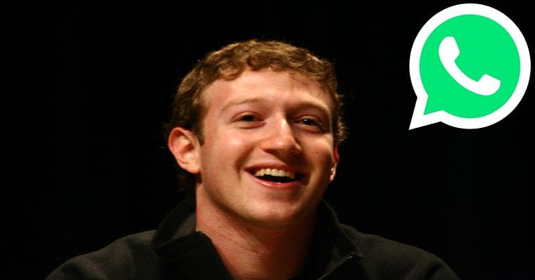 Mark Zuckerberg next to the WhatsApp logo