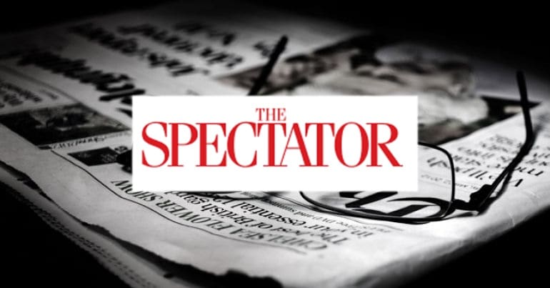 Spectator logo and glasses on newspaper