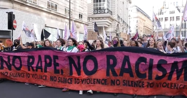 No Rape No Racism banner