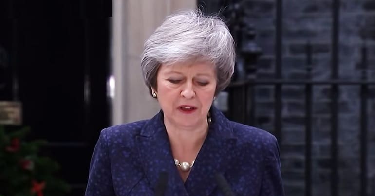 Theresa May looking down