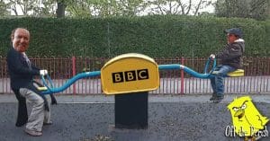 Image of Andrew Neil weighing down a seesaw