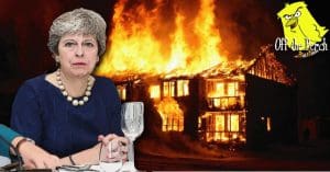 May in front of a burning building