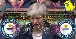 A distraught looking Theresa May with fireworks going off around her and the Guinness World Records logo
