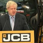 Boris Johnson giving a speech in front of a JCB digger