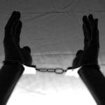 Hands in handcuffs