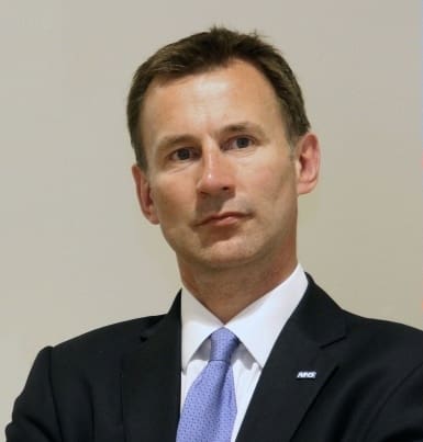 Jeremy Hunt and refugees on board a dingy