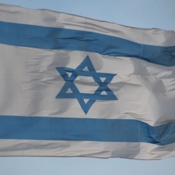 Israeli flag and The Guardian logo