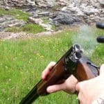 Cartridges being ejected from a shotgun
