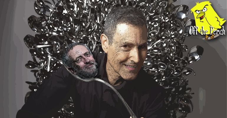 Uri Geller holding a spoon with Corbyn's hed on it