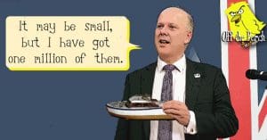 Chris Grayling holding a toy ferry and saying "It may be small, but i do have a million of them"
