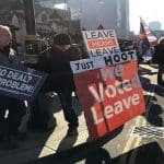 Protestors in favour of a hard Brexit with signs saying "No Deal? No Problem".