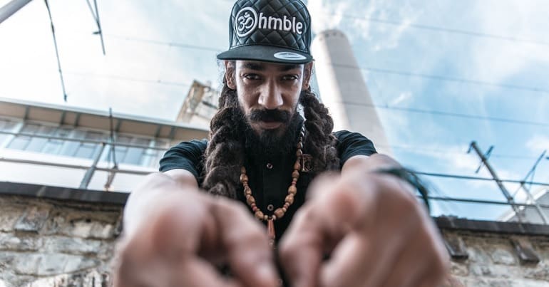 Reggae legend Cali P pointing at the camera