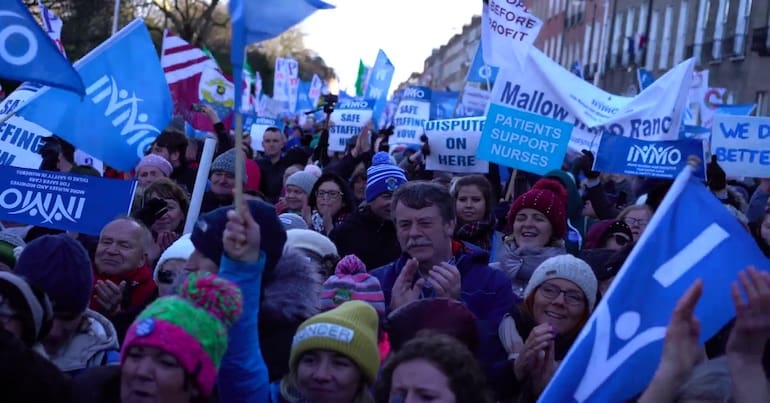 People protesting in Dublin in support of nurses and midwives on strike