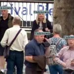 People in a crowd being scanned by facial recognition cameras
