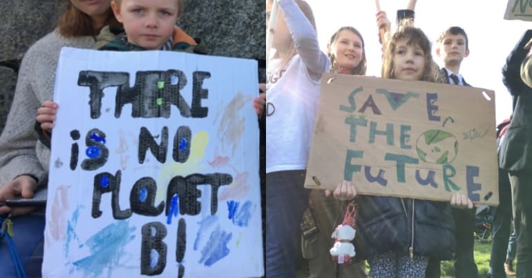 Kids with placards on climate strike