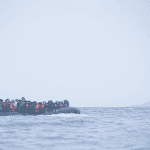 Refugees on a boat crossing the Mediterranean sea, heading from Turkish coast to the northeastern Greek island of Lesbos, 29 January 2016.