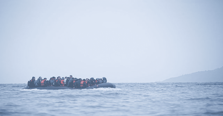 Refugees on a boat crossing the Mediterranean sea, heading from Turkish coast to the northeastern Greek island of Lesbos, 29 January 2016.