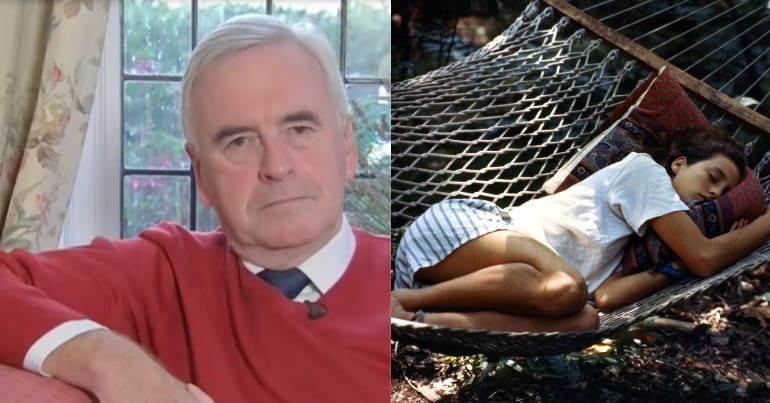 John McDonnell pictured next to someone relaxing in a hammock