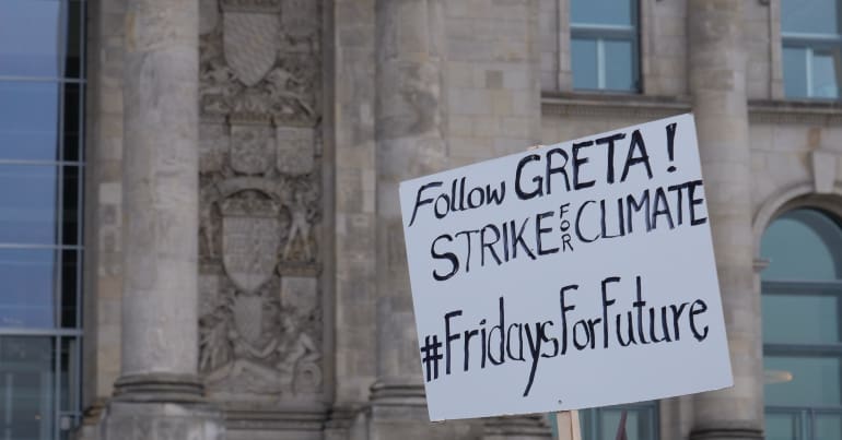Placard saying "Follow Greta Strike for climate"