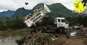 A lorry dumping waste into a river - it says 'legally binding concessions' on the side of it