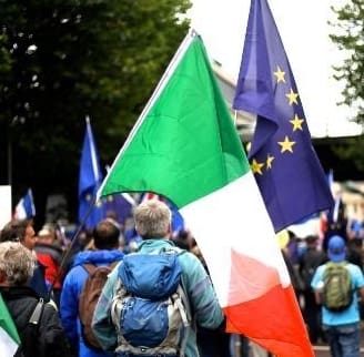 Photo of a list of figures in an accounts book alongside a photo of anti-Brexit protestors holding Irish and EU flags