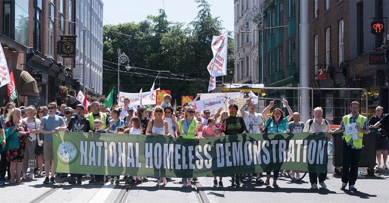 Demonstrators holding a banner that reads "National Homeless Demonstration"