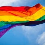 Rainbow flag flying in the breeze