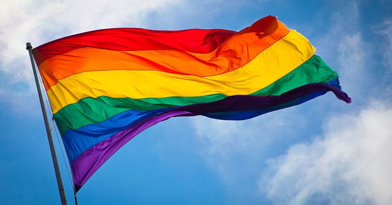 Rainbow flag flying in the breeze