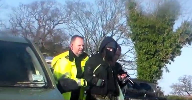 Police arresting a hunt saboteur