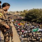 YPG fighters looking down at a demonstration in Rojava, January 2018.
