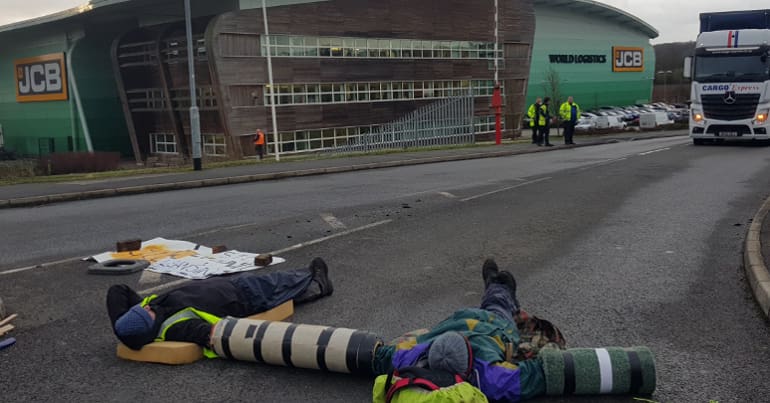 Activists blockade JCB headquarters