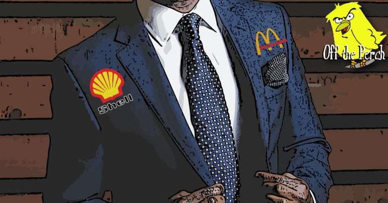 A man in a suit with Shell and McDonalds logos
