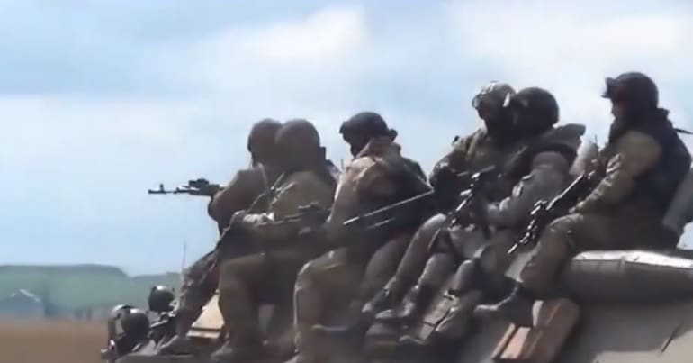 Arming Ukraine - Soldiers on top of vehicle in eastern Ukraine