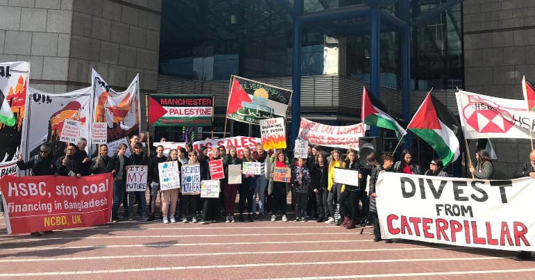 An alliance of protesters gather outside HSBC's AGM