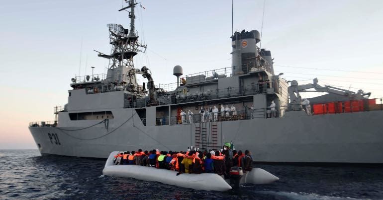 A picture of the Irish naval ship Eithne taking aboard refugees on the Mediterranean Sea.