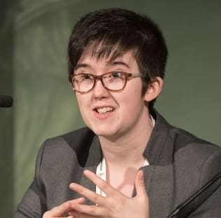 A picture of Lyra McKee along with a picture of the "Free Derry" mural in Derry.