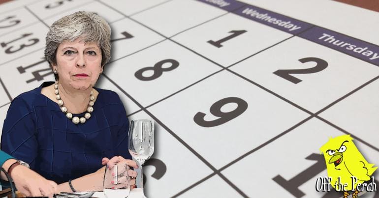 Theresa May in front of a calendar