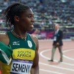 Caster Semenya wearing South Africa uniform and carrying flag