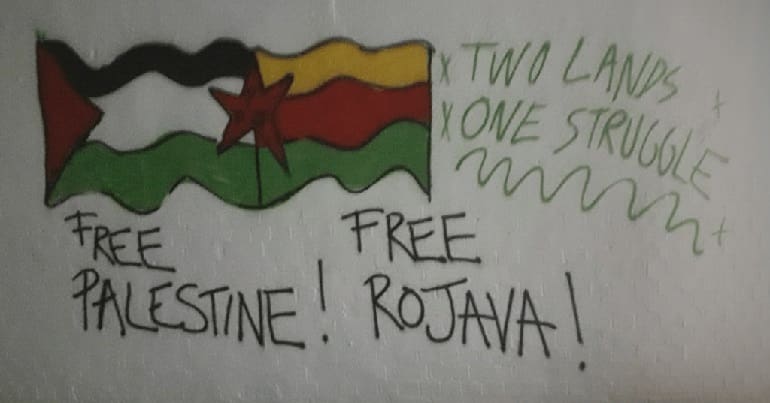 Free Palestine, Free Rojava flags and messages