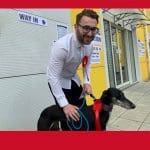Writer Josh Funnell with a dog at a polling station