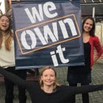 We Own It banner and team