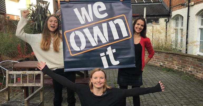 We Own It banner and team