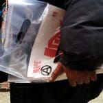 A person holding copies of DOPE newspaper