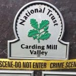 National Trust sign with crime scene tape