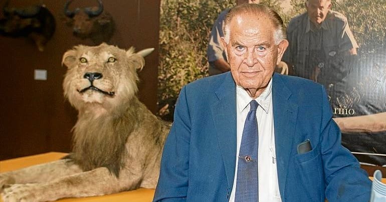 Trophy hunter Tony Sanchez-Arino poses next to a stuffed lion